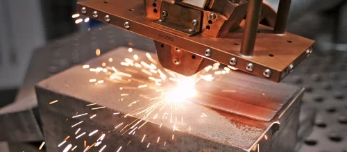Laser cladding process with wide stream nozzle optic on a metal by Laserline diode lasers