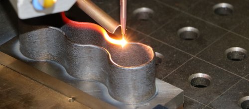 Additive manufacturing production of a geometrically complex component with wire feeder by Laserline diode lasers