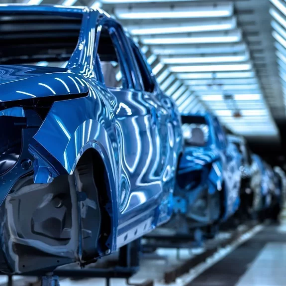 Row of finished car bodies in a production site welded together with laser by Laserline diode lasers